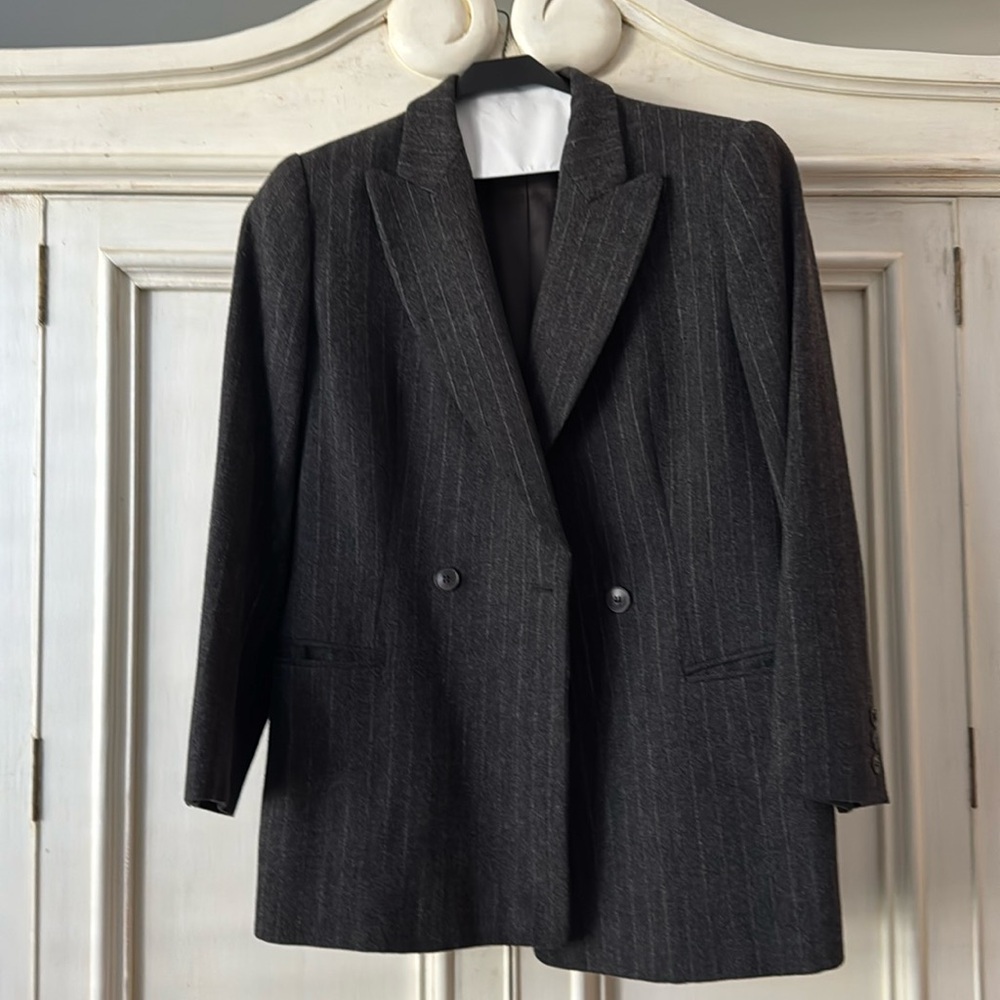 Grey lined pin striped jacket. Worn but in good  condition. Double breasted.
